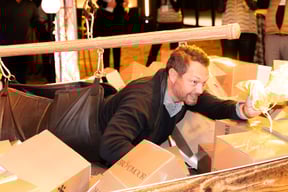 Guest enters the human claw machine.